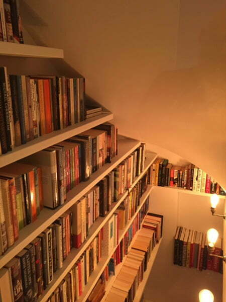 corner bookcase shelves under the stairs
